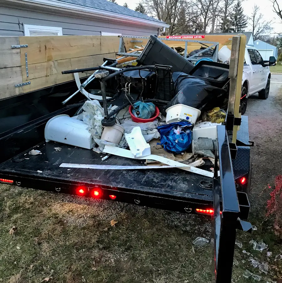 Roll-off dumpster delivered to a residential driveway in Tamiami